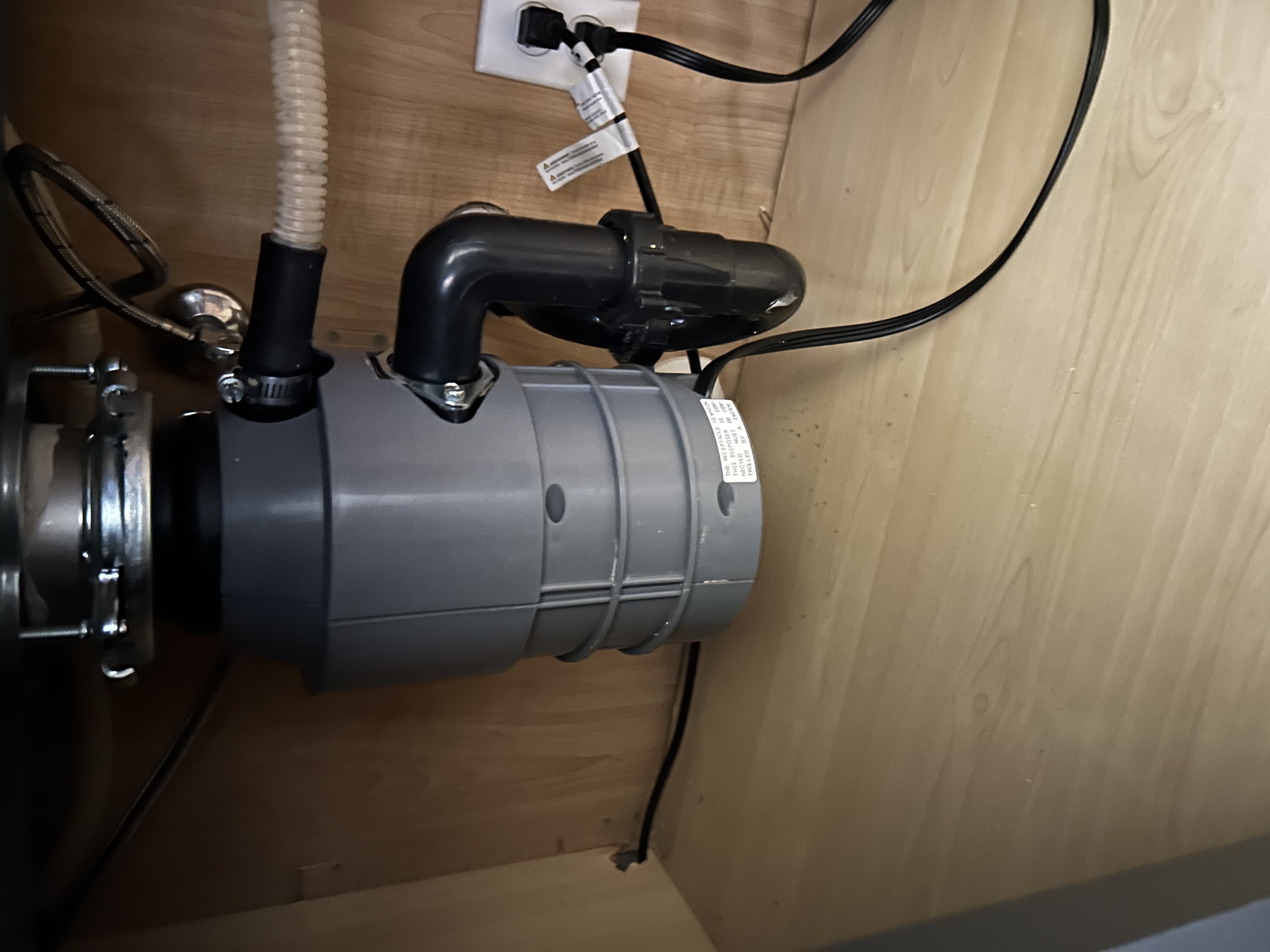 InSinkErator garbage disposal under kitchen sink in Peoria AZ — Desert Rain Plumbing