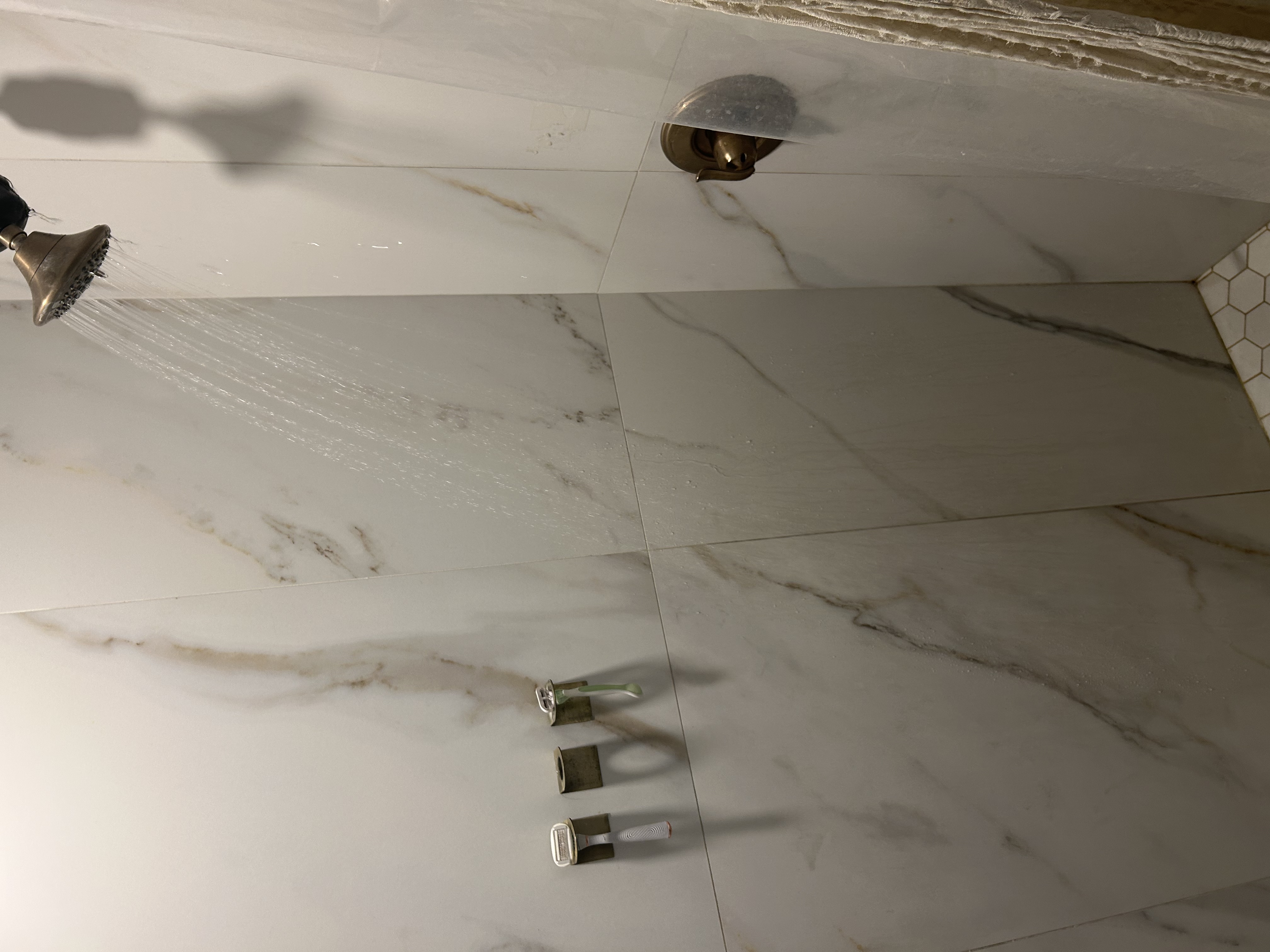Scottsdale guest bath shower after strainer removed and drain cleared — water running confirms full flow restored — Desert Rain Plumbing